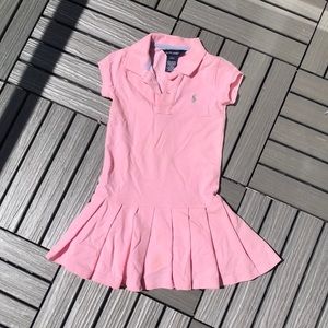 Kids Pink dress with ruffles at the bottom.
